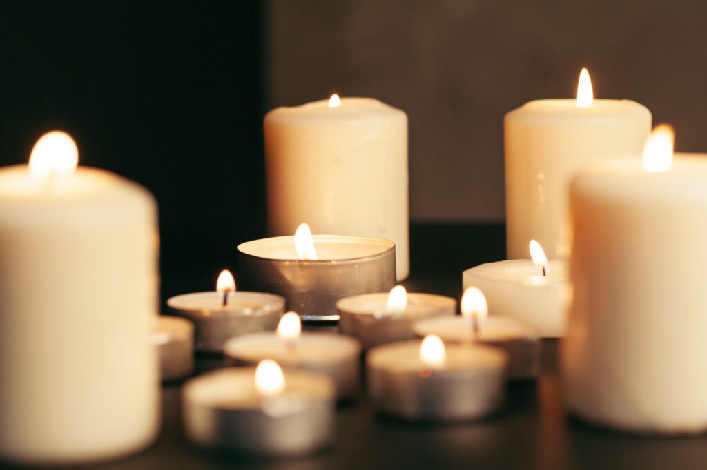 How to Style Your Home Décor for a Modern, Minimal Look Many candles burning at night. Many candle flames glowing on dark background